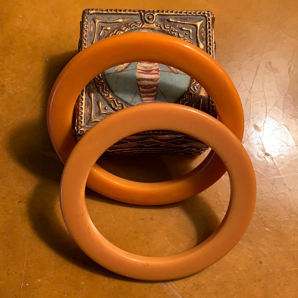 Pair of bakelite(?) bangles in apricot & amber colors